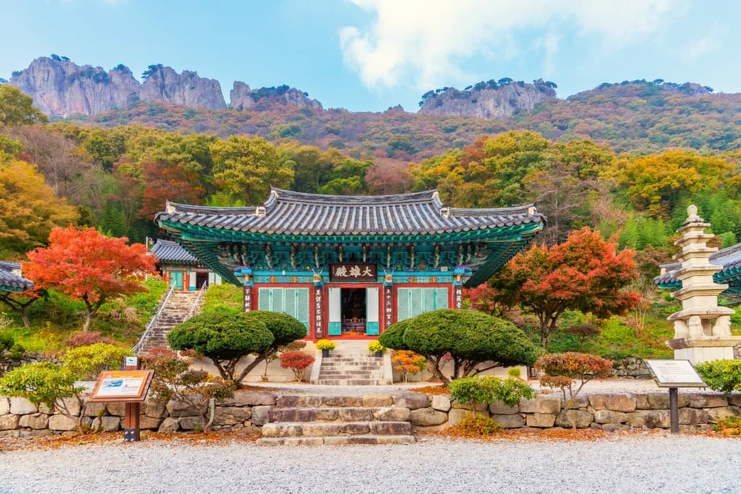 Naejangsa temple courtyard with rock peaks and autumn colors behind